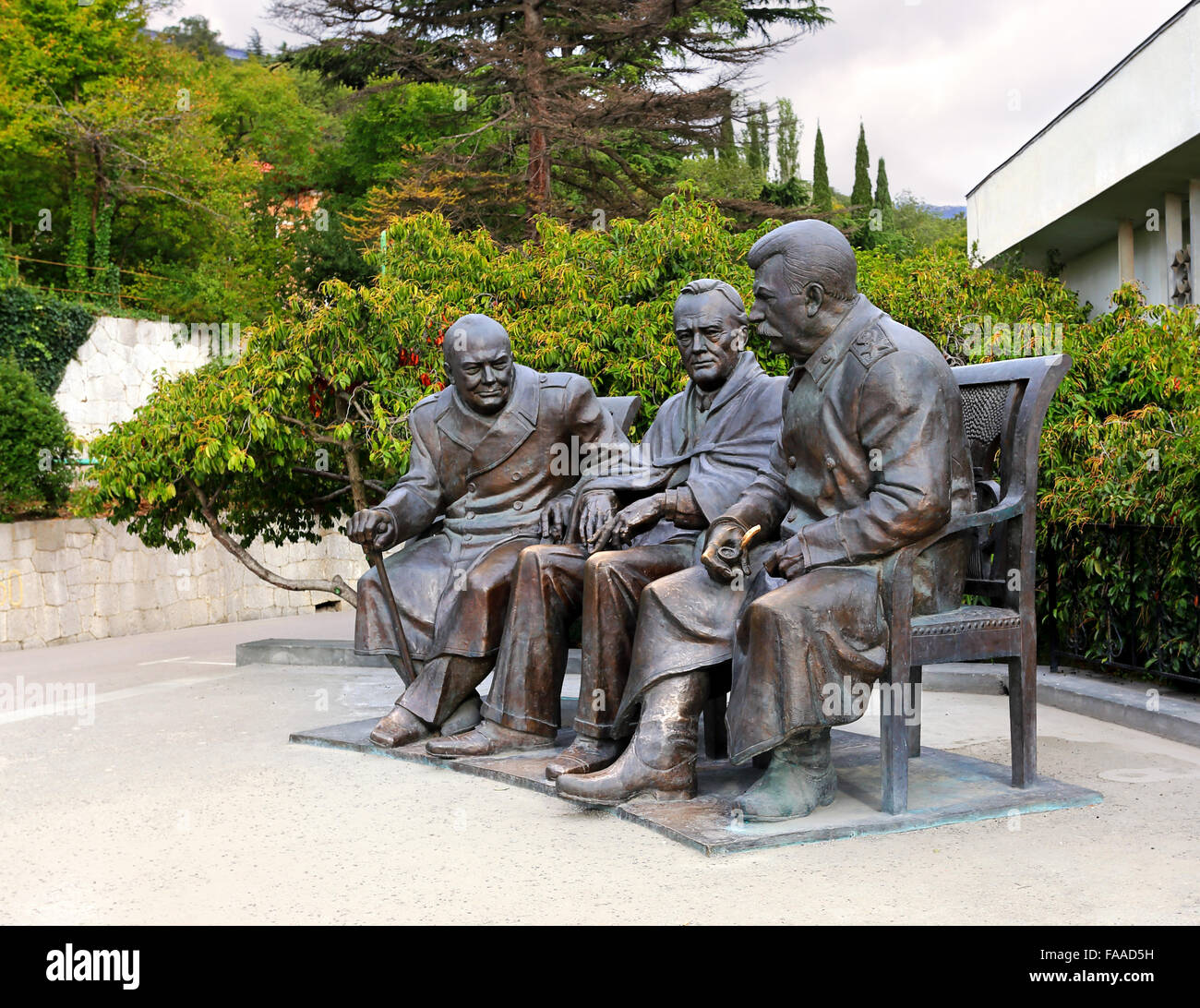 Monument to the 'Big three' in bronze with figures of Stalin, Roosevelt and Churchill in Yalta Stock Photo