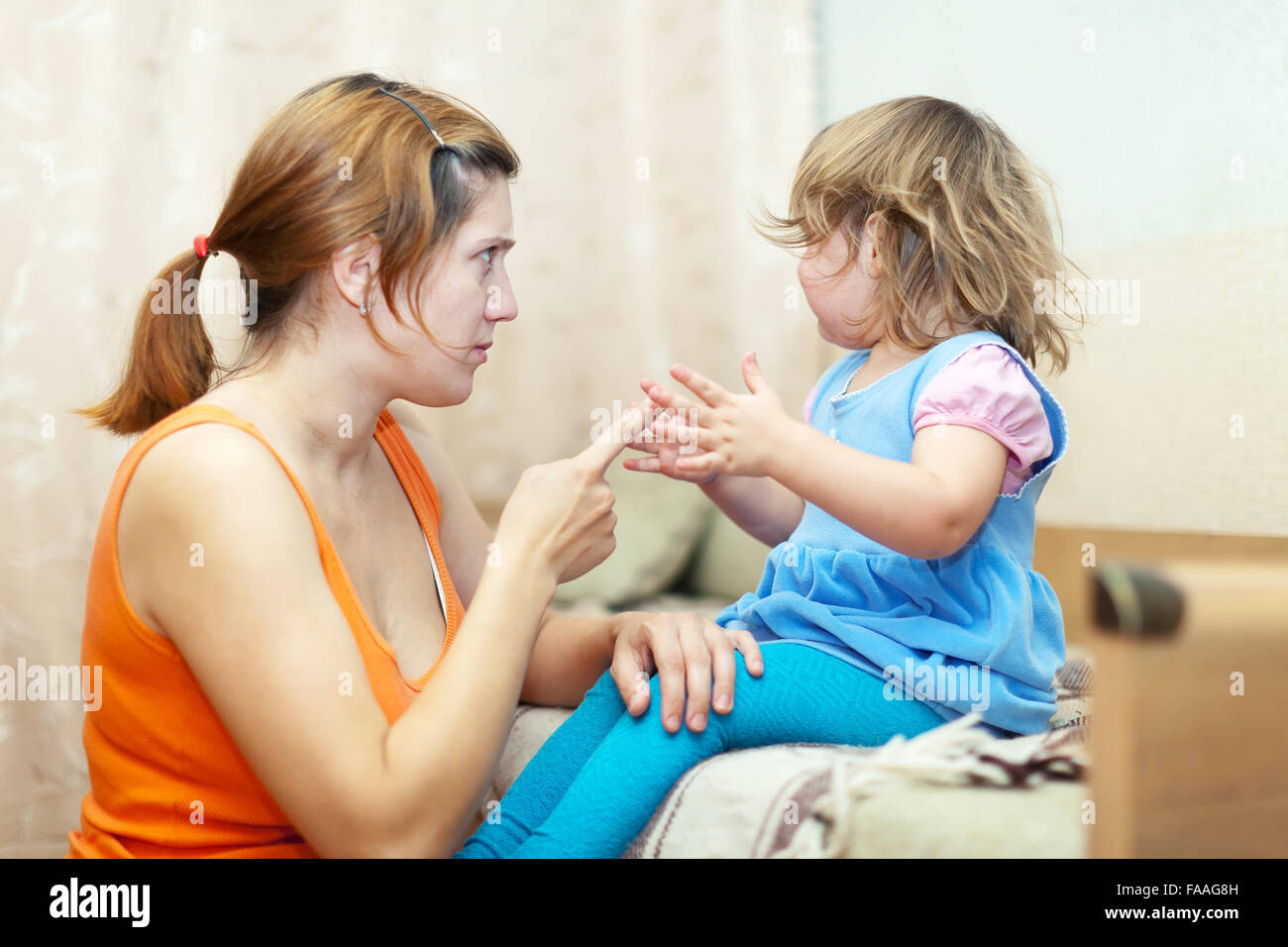 https://c8.alamy.com/comp/FAAG8H/woman-scolds-crying-child-at-home-interior-FAAG8H.jpg