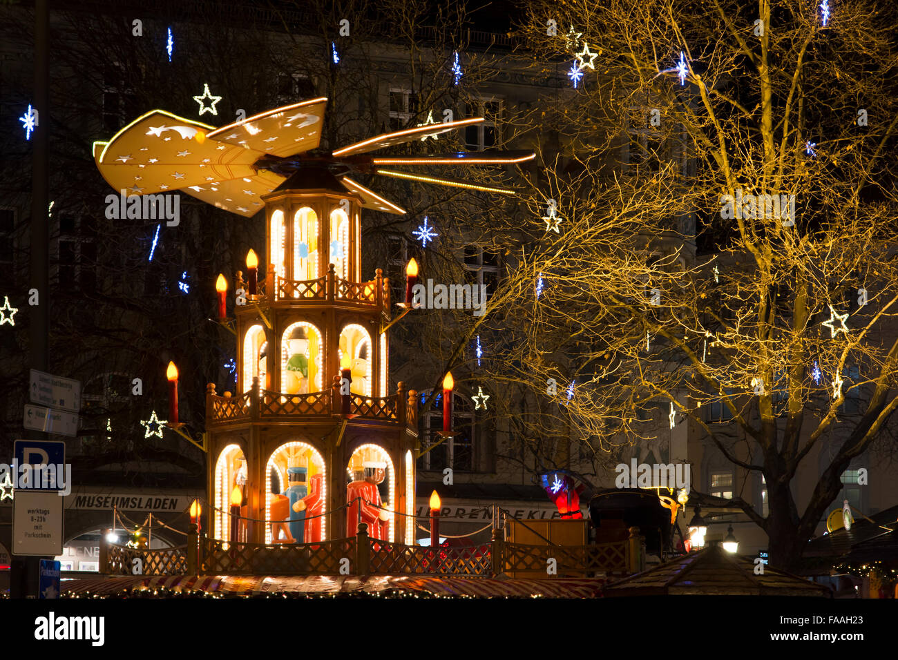 MUNICH, GERMANY - DECEMBER 12: Traditional christmas market at night with a illuminated pyramid in Munich Stock Photo
