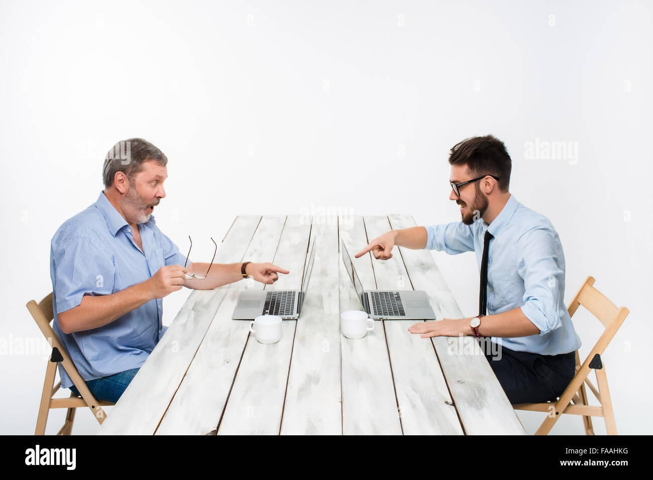 Two Team Members The two colleagues working together at office on white background Stock ...