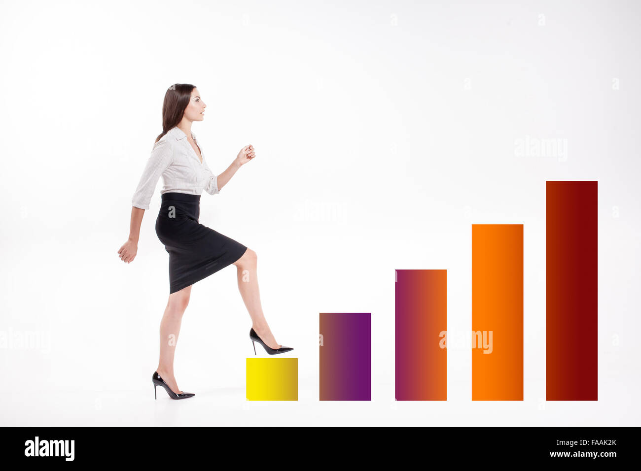 Young businesswoman walking up on stairs Stock Photo - Alamy