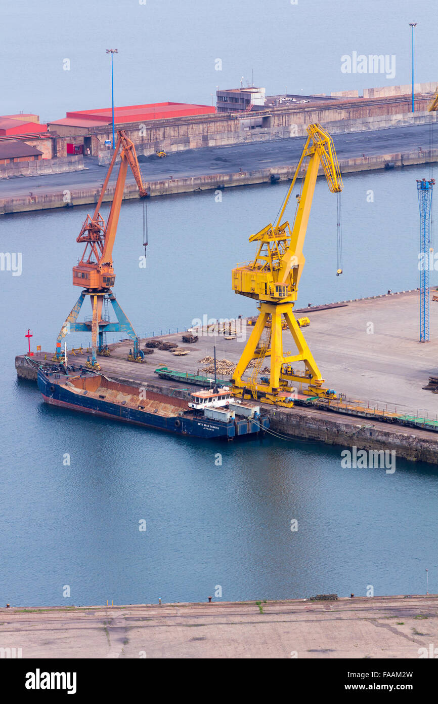 Huge cranes at a port charge Stock Photo