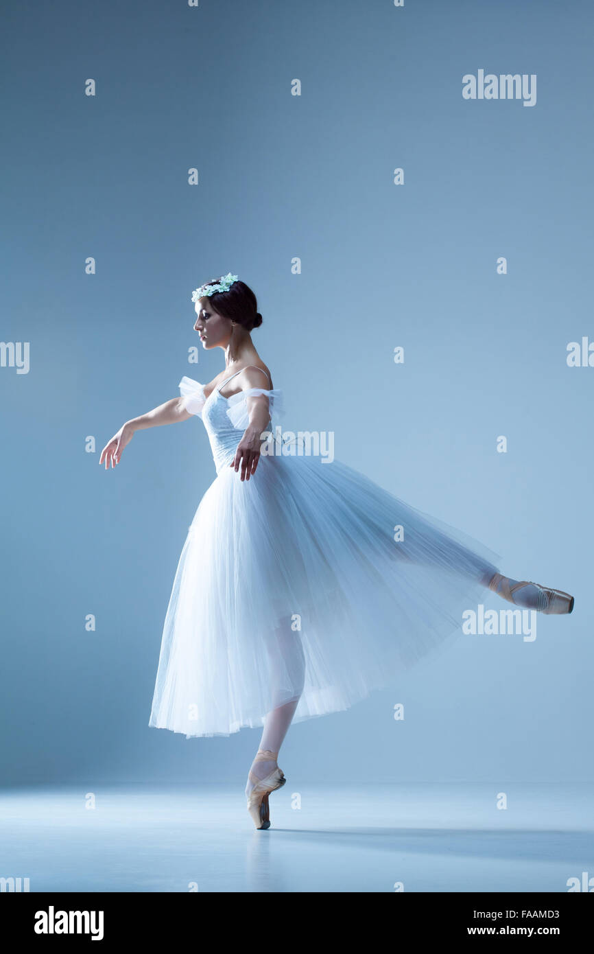 Portrait of the ballerina on blue background Stock Photo - Alamy