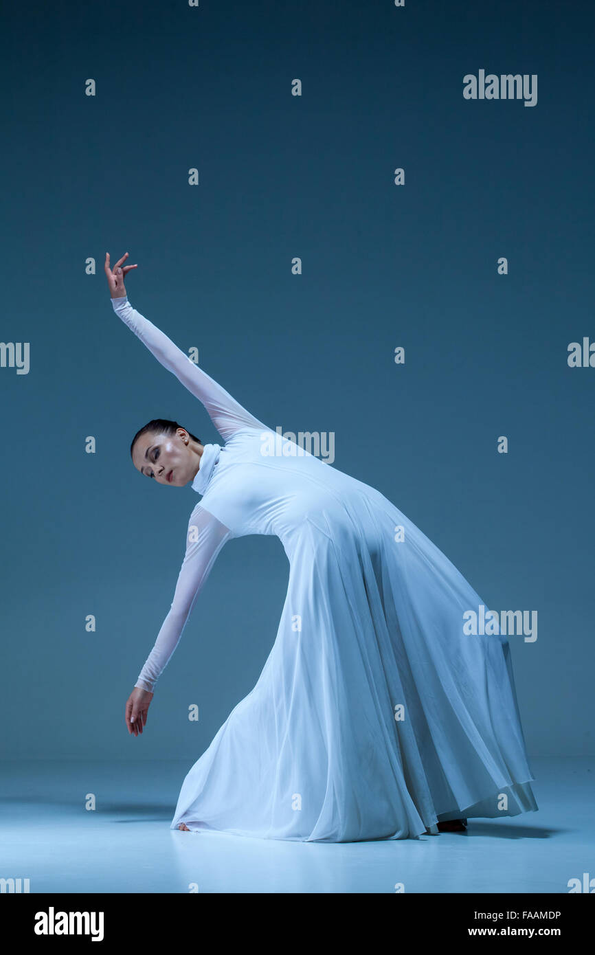 Portrait of the ballerina on blue background Stock Photo - Alamy