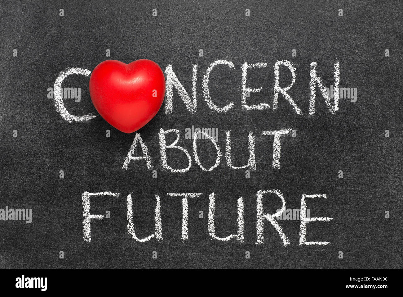 concern about future phrase phrase handwritten on blackboard with heart symbol instead O Stock Photo