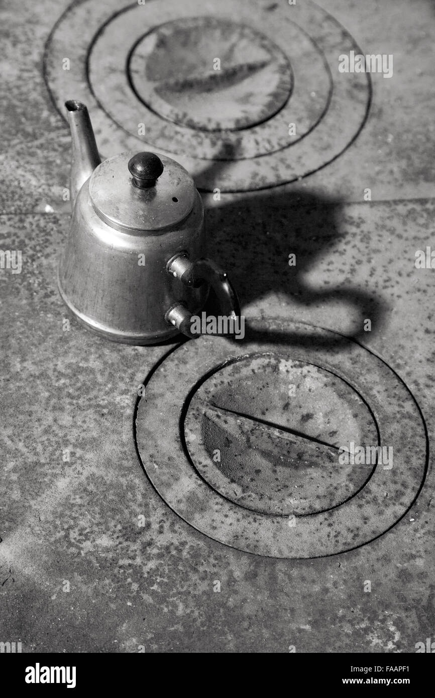Kettle on a rusty old cast iron stove Stock Photo Alamy