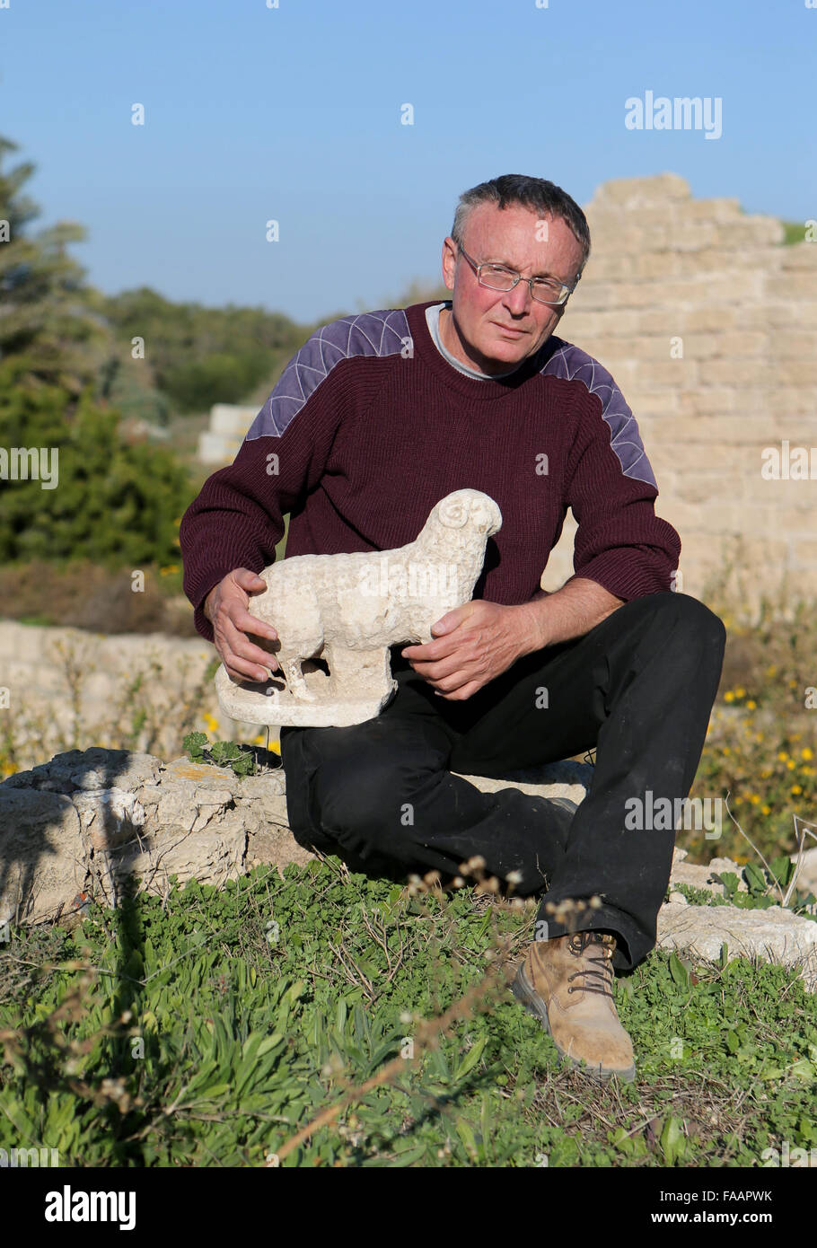 Israel. 24th Dec, 2015. Photo taken on Dec. 24, 2015 shows a Byzantine-era marble sculpture of a lamb in Israel. Archaeologists on Thursday unearthed a Byzantine-era marble sculpture of a lamb near the Ancient Caesarea Church in the Caesarea National Park, in northern Israel. Experts believe that the lamb served as part of the decoration in the 6th-7th century CE church that was discovered adjacent to the ancient port. Credit:  JINIPIX/Nimrod Glikman/Xinhua/Alamy Live News Stock Photo