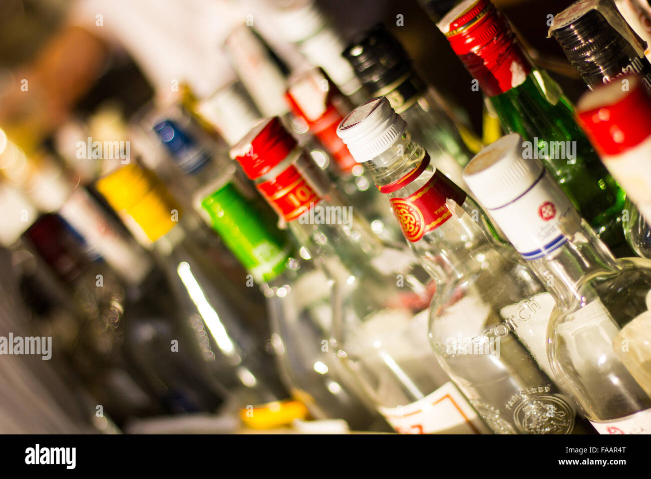 Various drinks bottles and bottle tops Stock Photo