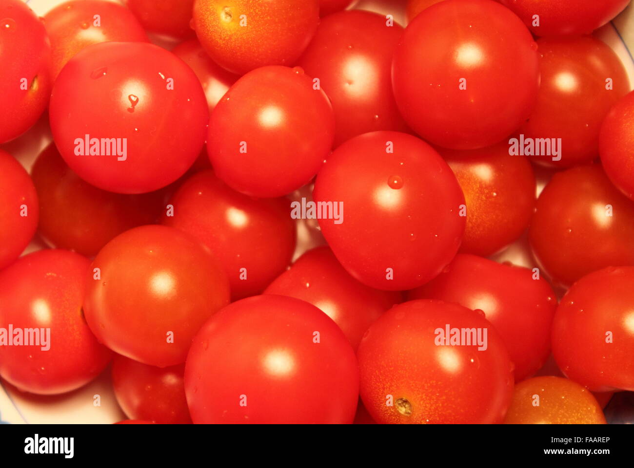 Many juicy Pachino tomatoes for sale in a market stall Stock Photo - Alamy