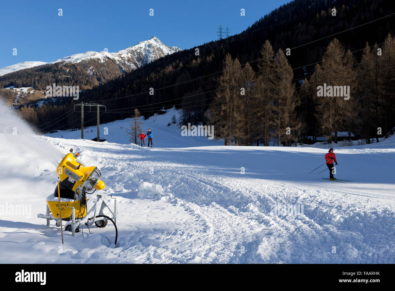 Ulrichen, Switzerland. 25th December, 2015. A snow cannon is producing artificial snow for crosscountry skier. There is a lack of snow in the skiing areas of Switzerland. Slopes are created with artificial snow to attract some tourists and reduce the economic loss Credit:  Dominic Steinmann/Alamy Live News Stock Photo