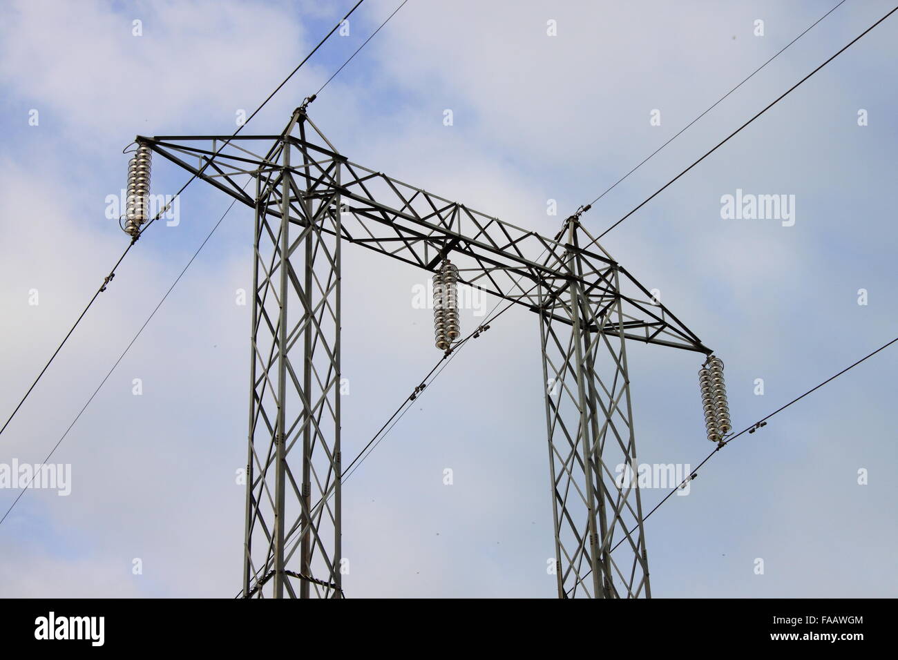 Power line tower on a blue sky background Stock Photo - Alamy