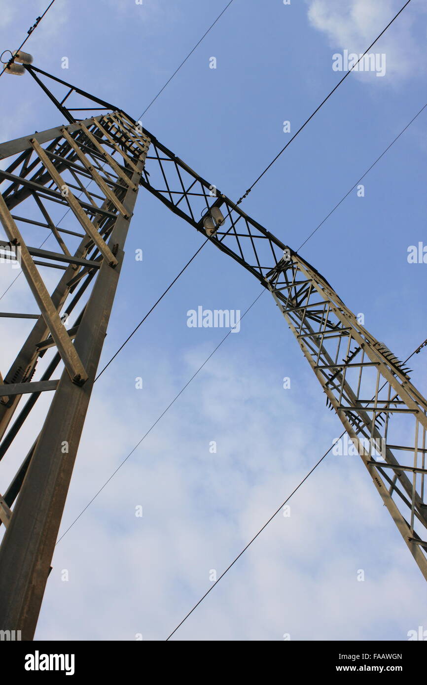 Power line tower on a blue sky background Stock Photo - Alamy