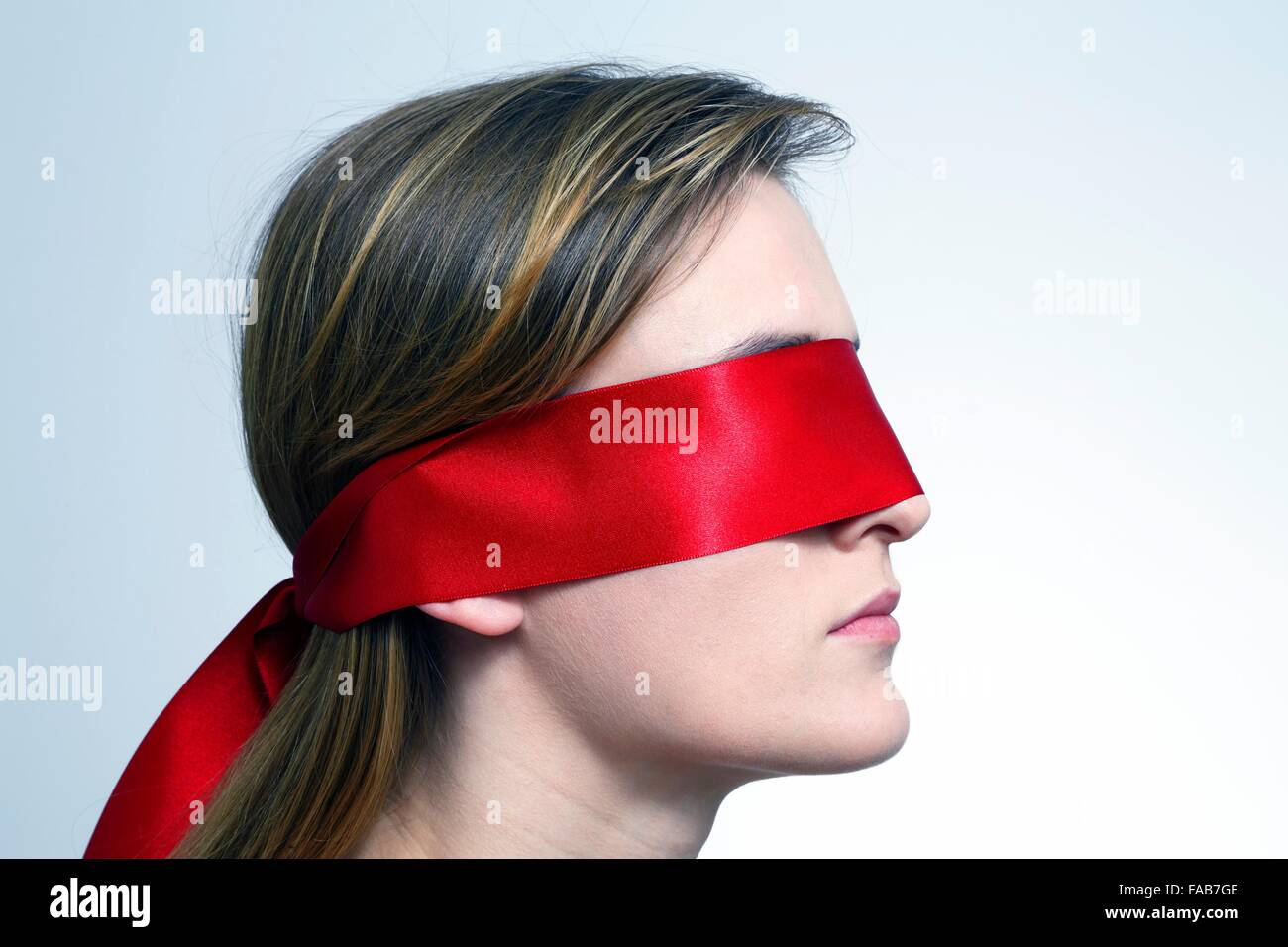 Young woman blindfolded Stock Photo by ©semisatch 66901649