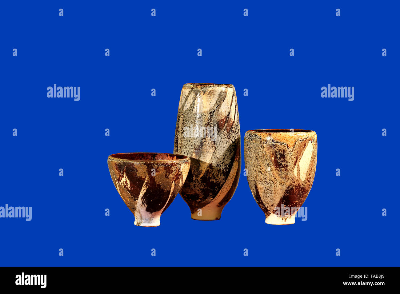 Three vases  of brown color with patterns  on the white background Stock Photo