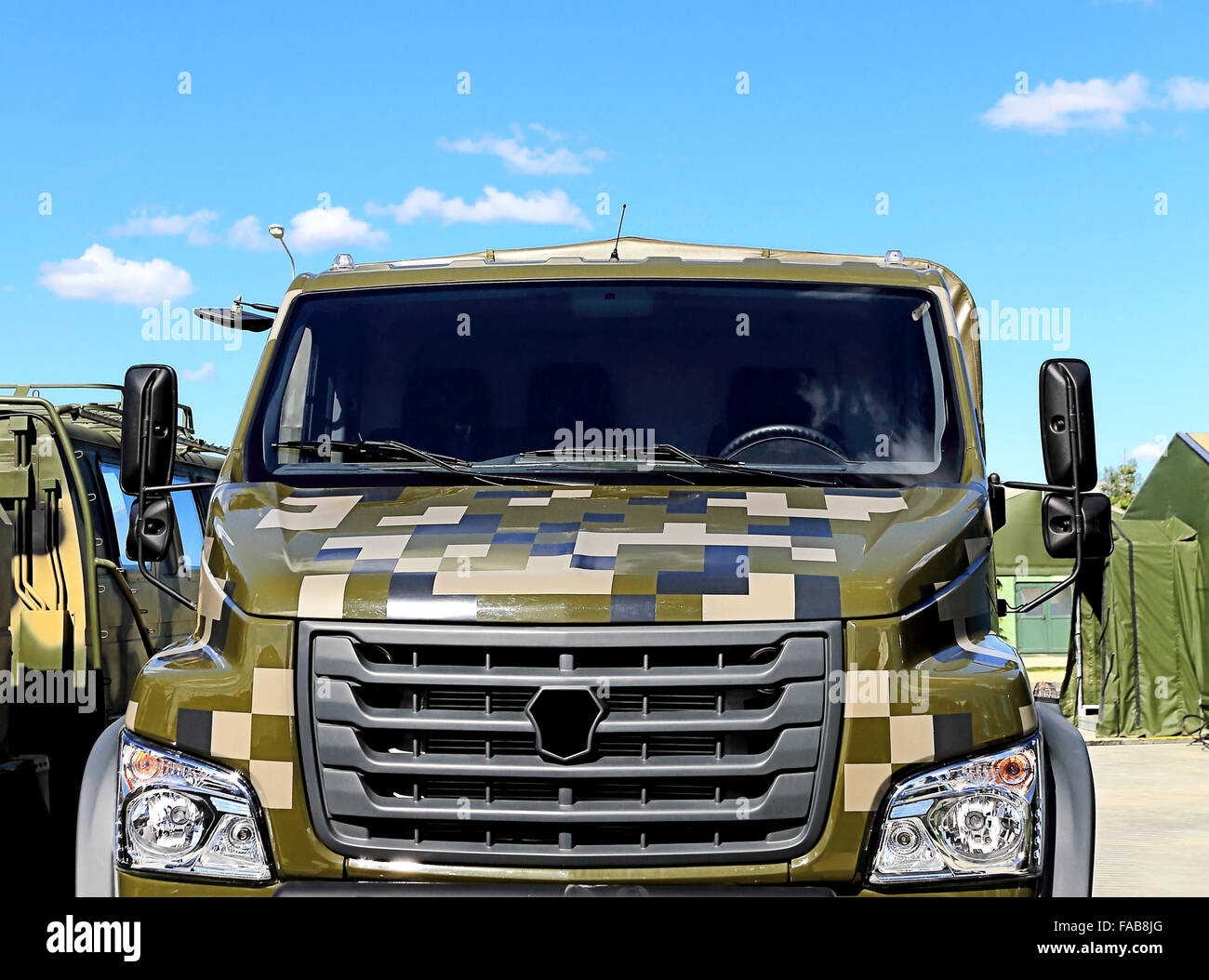 Front view of heavy army truck  with camouflage masking coloration Stock Photo