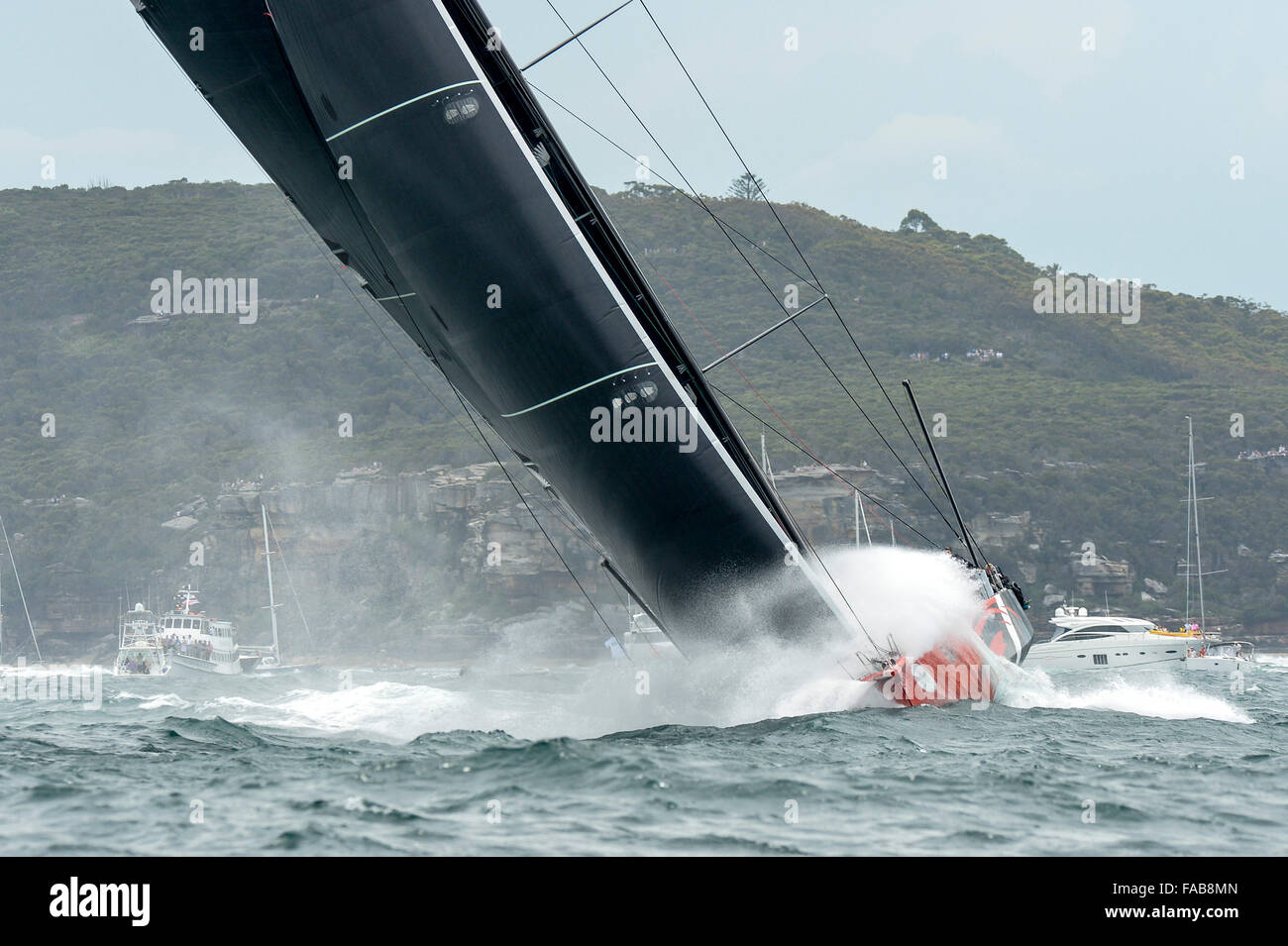 Sydney, Australia. 26th Dec, 2015. Rolex Sydney to Hobart Yacht race 2015. Comanche owned by Jim Clark &amp; Kristy Hinze Clark from SA skippered by skipper Ken Read type 100 Supermaxi during the start of the 629 nautical mile race from Sydney to Hobart on Sydney Harbour. Credit:  Action Plus Sports/Alamy Live News Stock Photo
