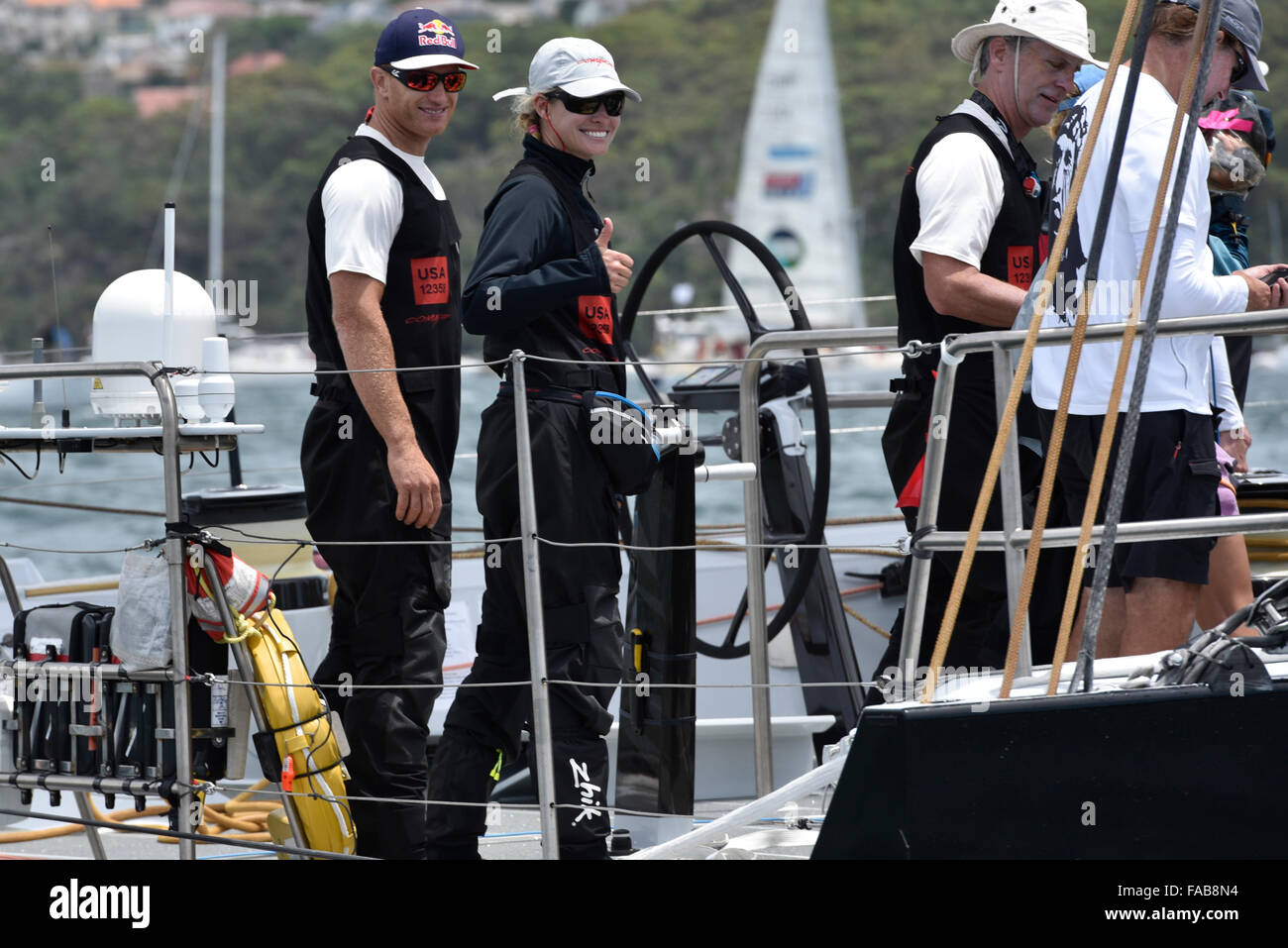 Sydney, Australia. 26th Dec, 2015. Rolex Sydney to Hobart Yacht race 2015. Comanche owned by Jim Clark &amp; Kristy Hinze Clark from SA skippered by skipper Ken Read type 100 Supermaxi during the start of the 629 nautical mile race from Sydney to Hobart on Sydney Harbour. Kristy gives the thumbs up ahead of the race. Credit:  Action Plus Sports/Alamy Live News Stock Photo