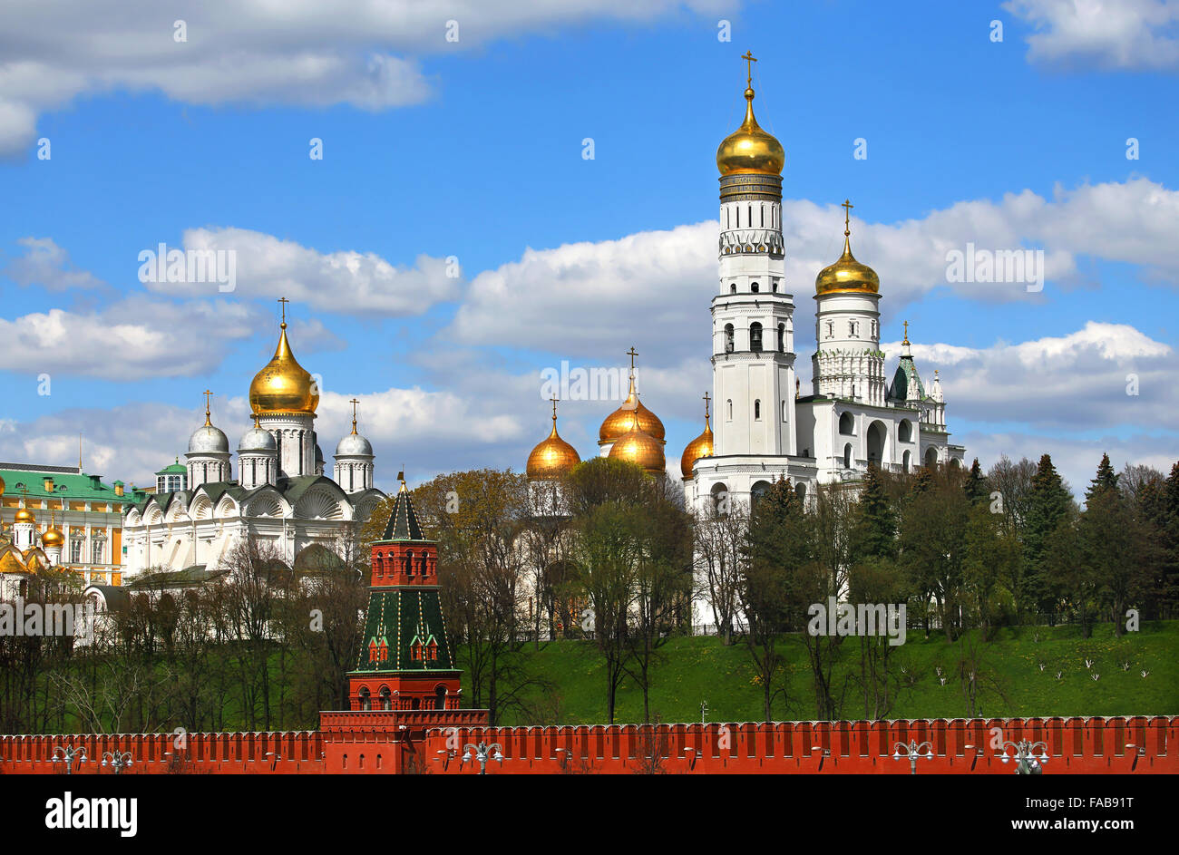 Cathedrals  of Moscow Kremlin behind  red kremlin wall Stock Photo