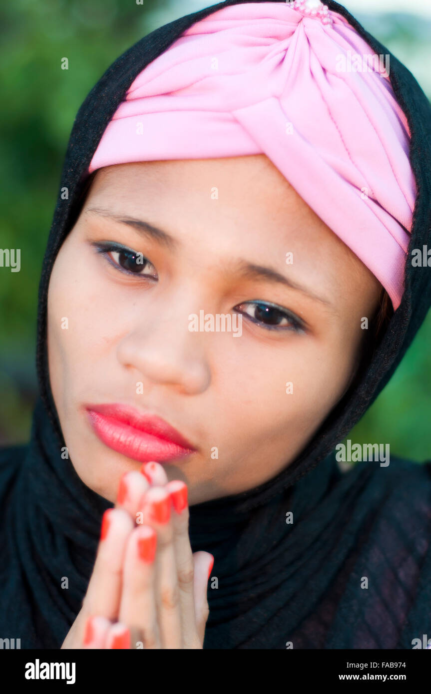 Young woman wearing pink hijab hi-res stock photography and images - Alamy