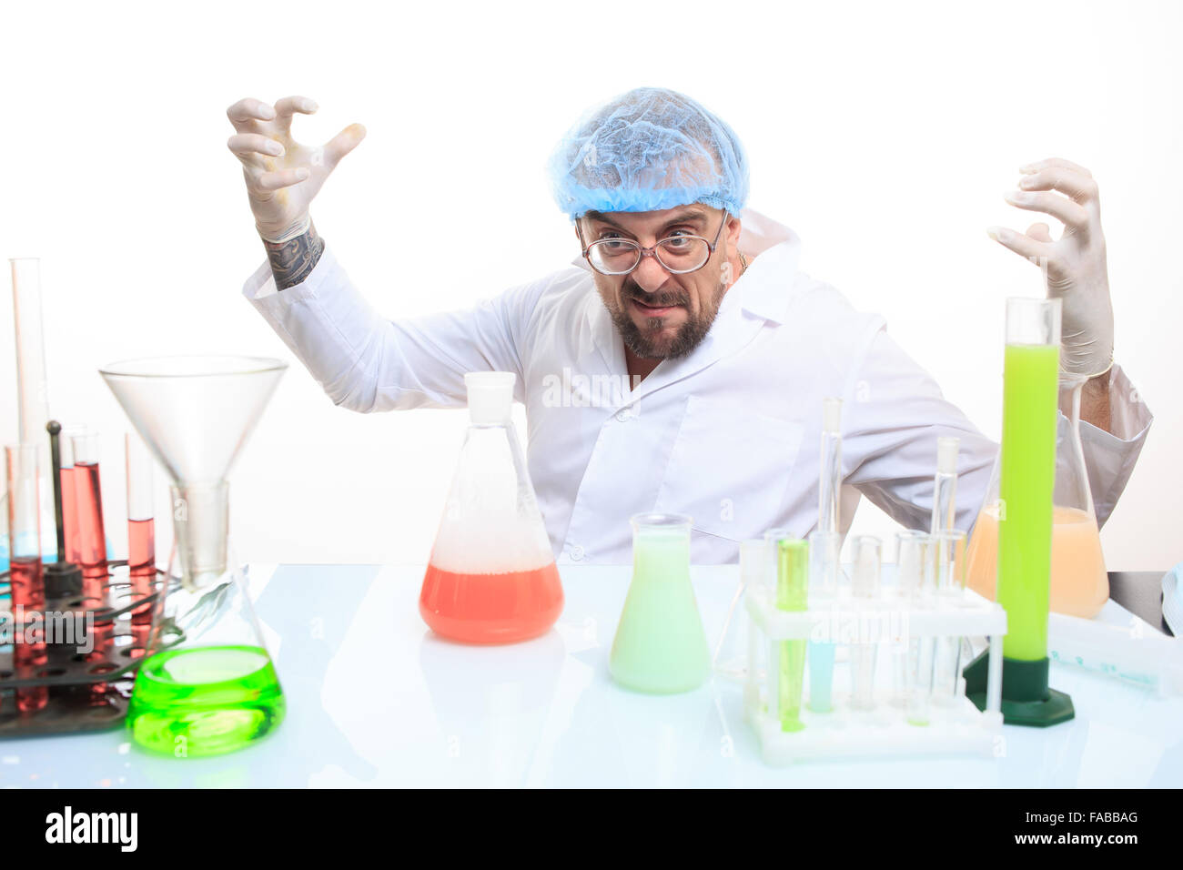 Mad chemist in the lab doing reaction Stock Photo - Alamy