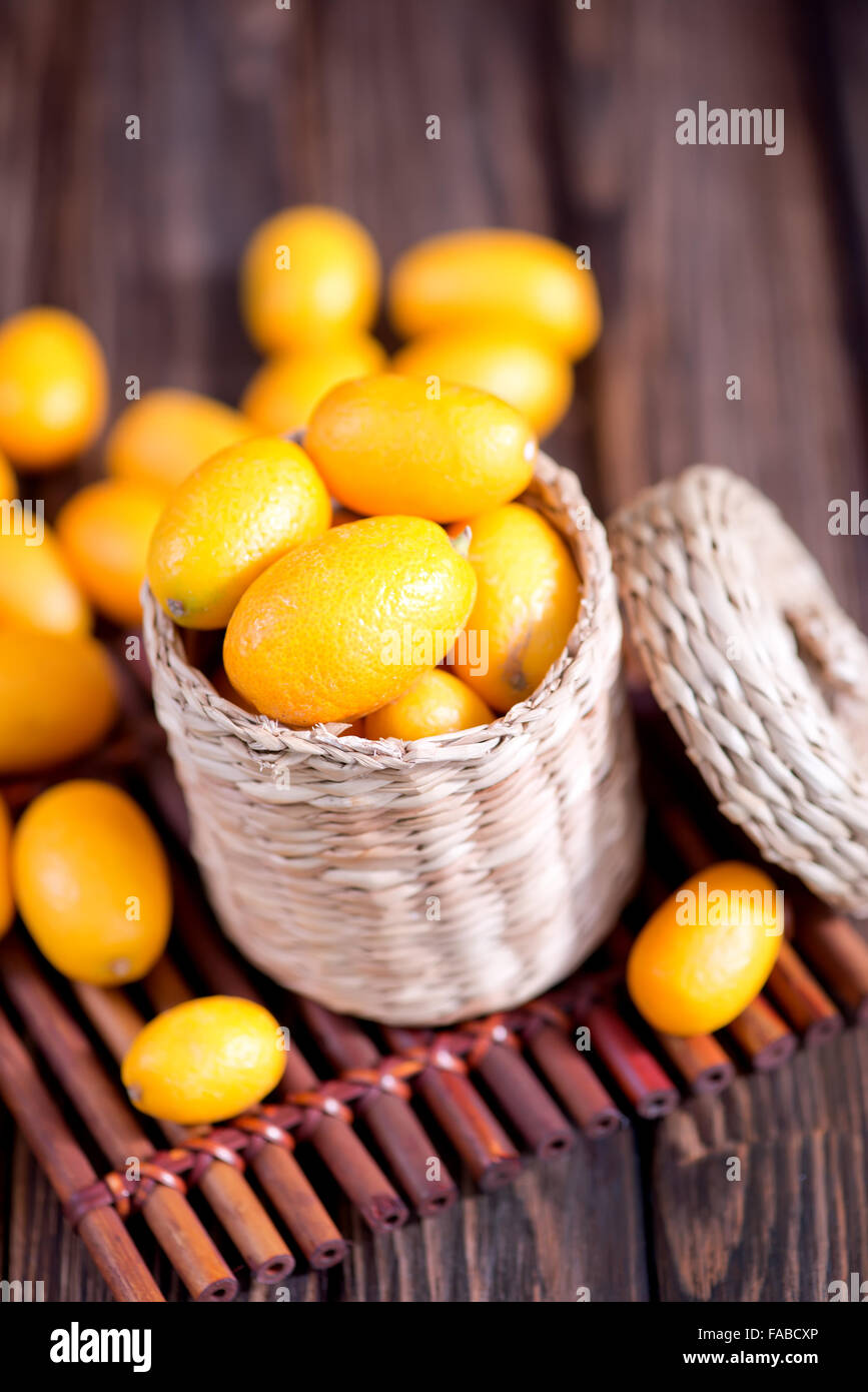 kumqwat on the wooden table, fresh kumqwat Stock Photo - Alamy