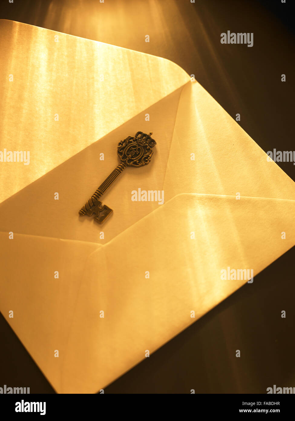 ray of light fall on key and envelope Stock Photo