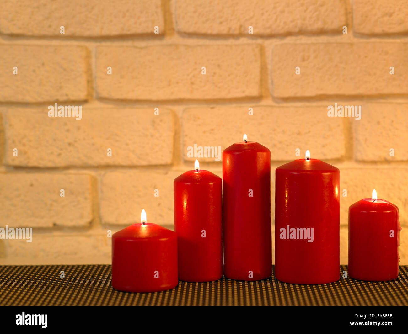 row of candle light with different height Stock Photo Alamy