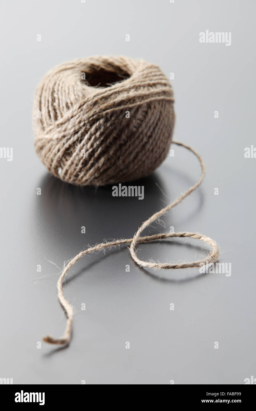 Hemp rope on the gray background Stock Photo - Alamy