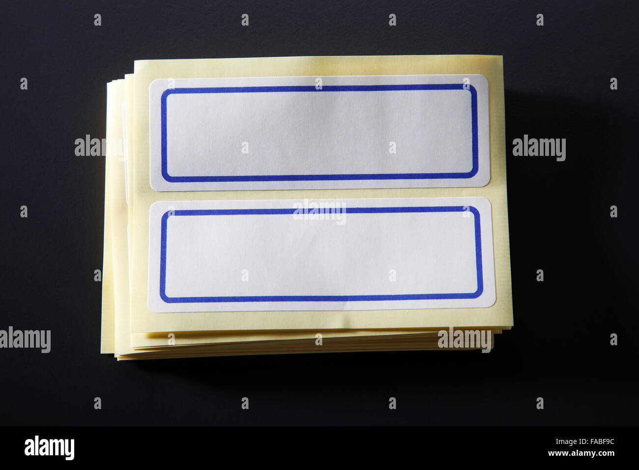 Blank label on the black Stock Photo - Alamy
