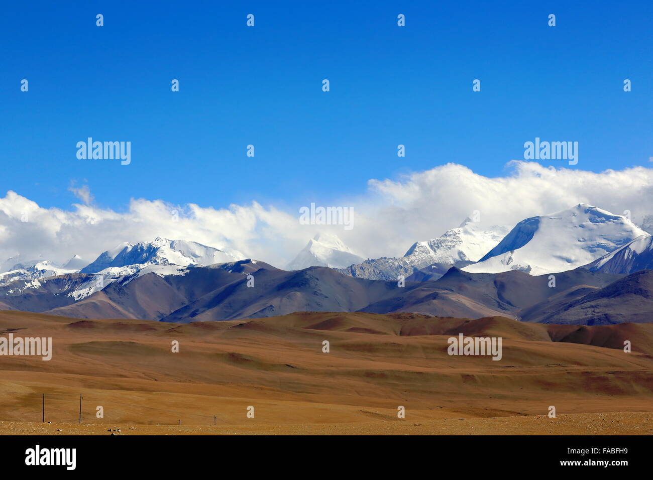 L.to R.= Mounts Lapche Kang II 7250 ms.+L.Kang I 7367 ms.+L.Kang West 7072 ms.+Colangma 6952 ms.+Gyao Kang 6720 ms. From Tong La Stock Photo