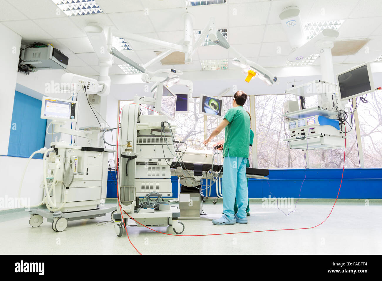 A doctor is operating in a new surgical room in a modern hospital Stock ...