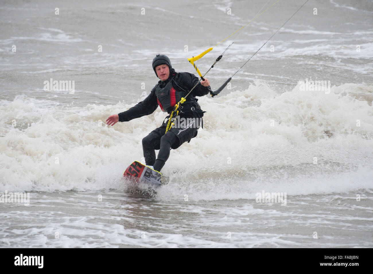 Aberystwyth, Wales, UK. 26th December, 2015. A man kite surfing on the