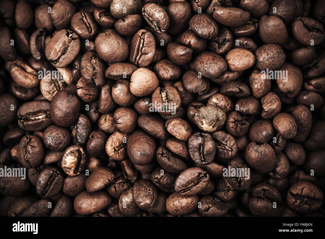 Closeup photo background with dark roasted coffee beans Stock Photo - Alamy