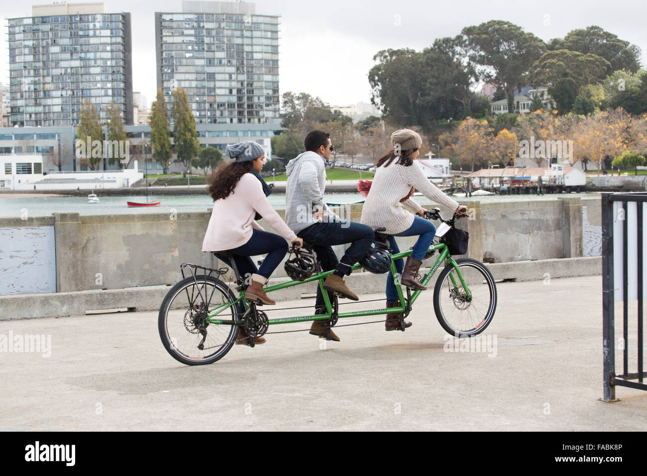 3 person tandem cycle on the quay at San Francisco Maritime National  Historical Park Stock Photo - Alamy