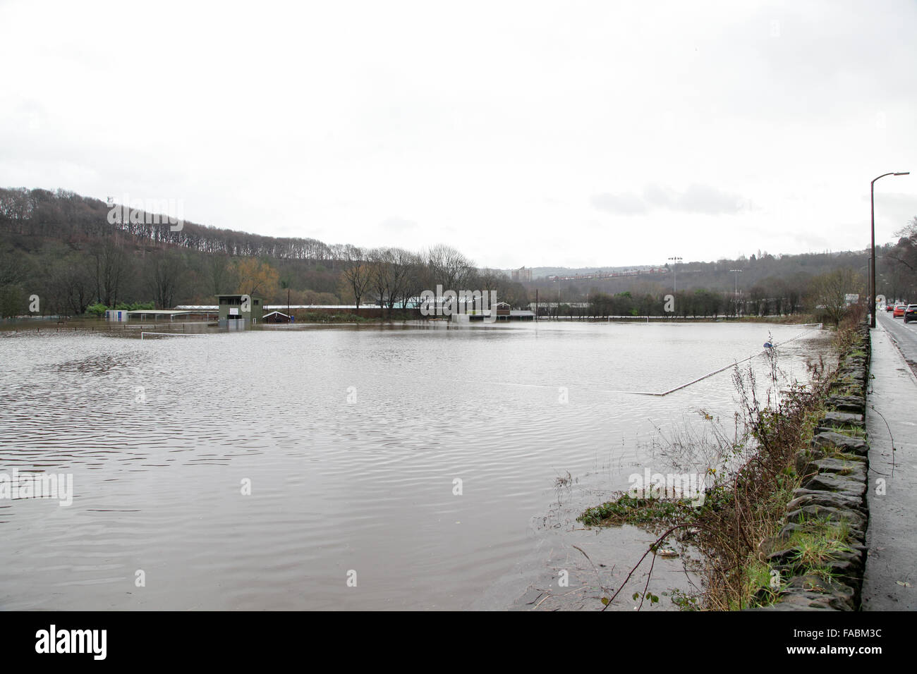 Halifax, West Yorkshire, UK. 26th December, 2015. Heath RUFC in Greetland, Halifax has been flooded once again after heavy rain hits the region and causes more disruptions. Sea containers are floating around as the river Calder overflowed onto their pitch, the adjoining football pitch and the Model car racing track. Credit:  Mick Flynn/Alamy Live News Stock Photo