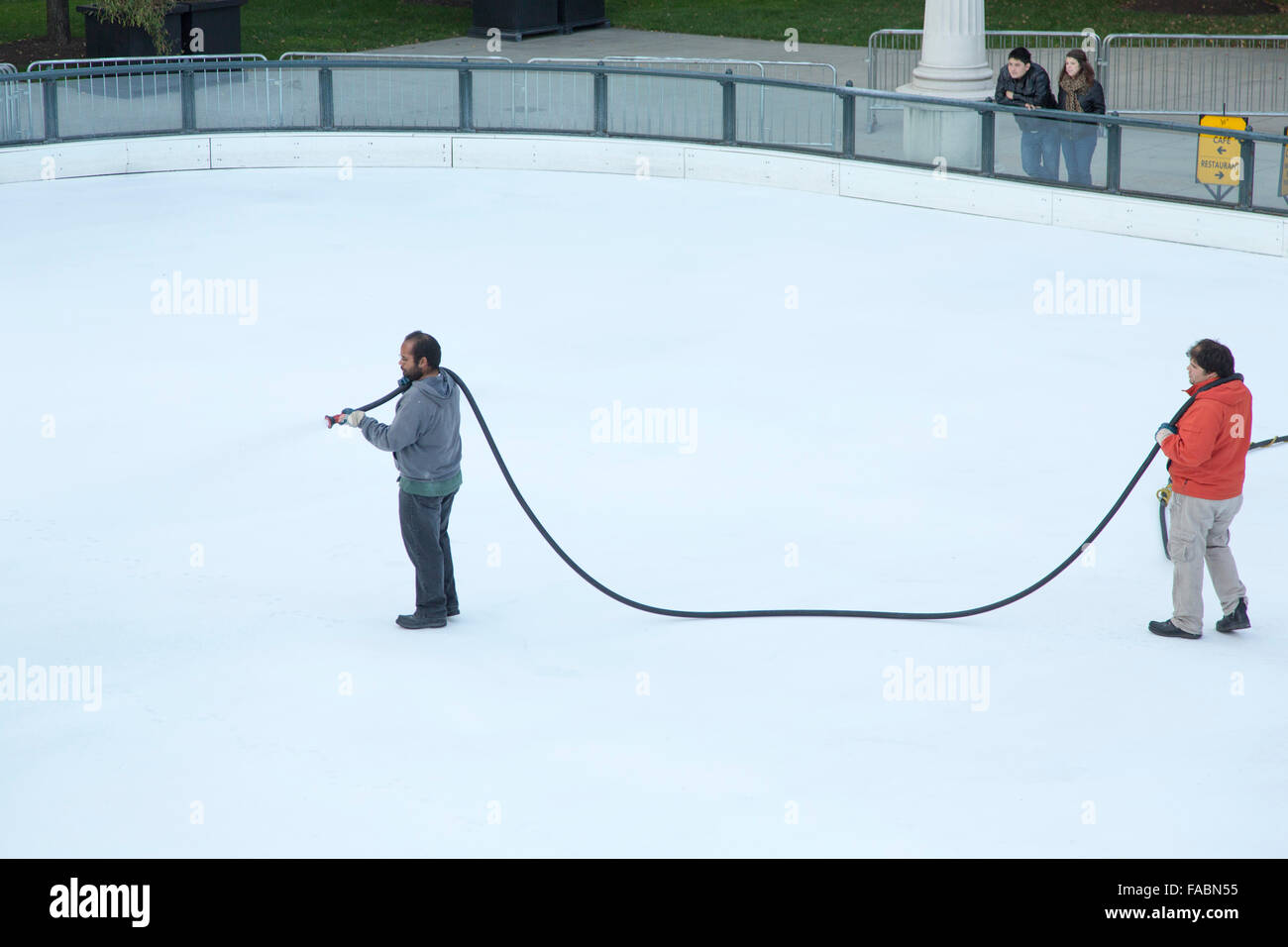 Men working on the ice of the ice rink at McCormick Tribune Plaza & Ice