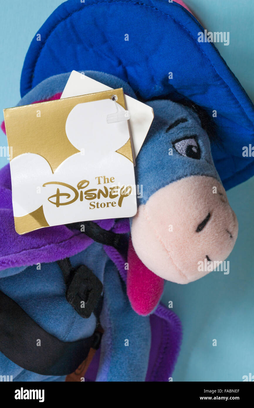 The Disney Store Musketeer Eeyore soft cuddly toy from Winnie the Pooh set on blue background ...
