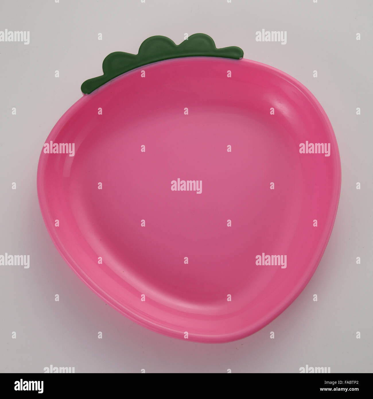 pink strawberry shaped plate on the white background Stock Photo Alamy