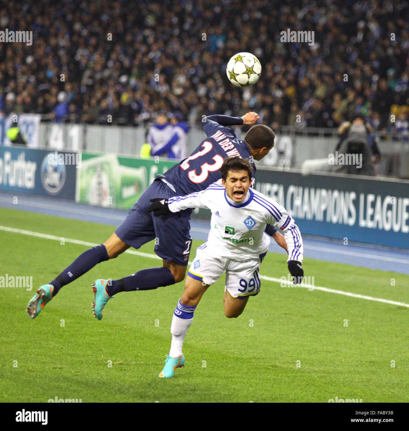 KYIV, UKRAINE - NOVEMBER 21, 2012: Gregory van der Wiel of FC Paris Saint-Germain (L, #23) fights for a ball with Dudu of FC Dynamo Kyiv (R, #99) during their UEFA Champions League game on November 21, 2012 in Kyiv, Ukraine Stock Photo