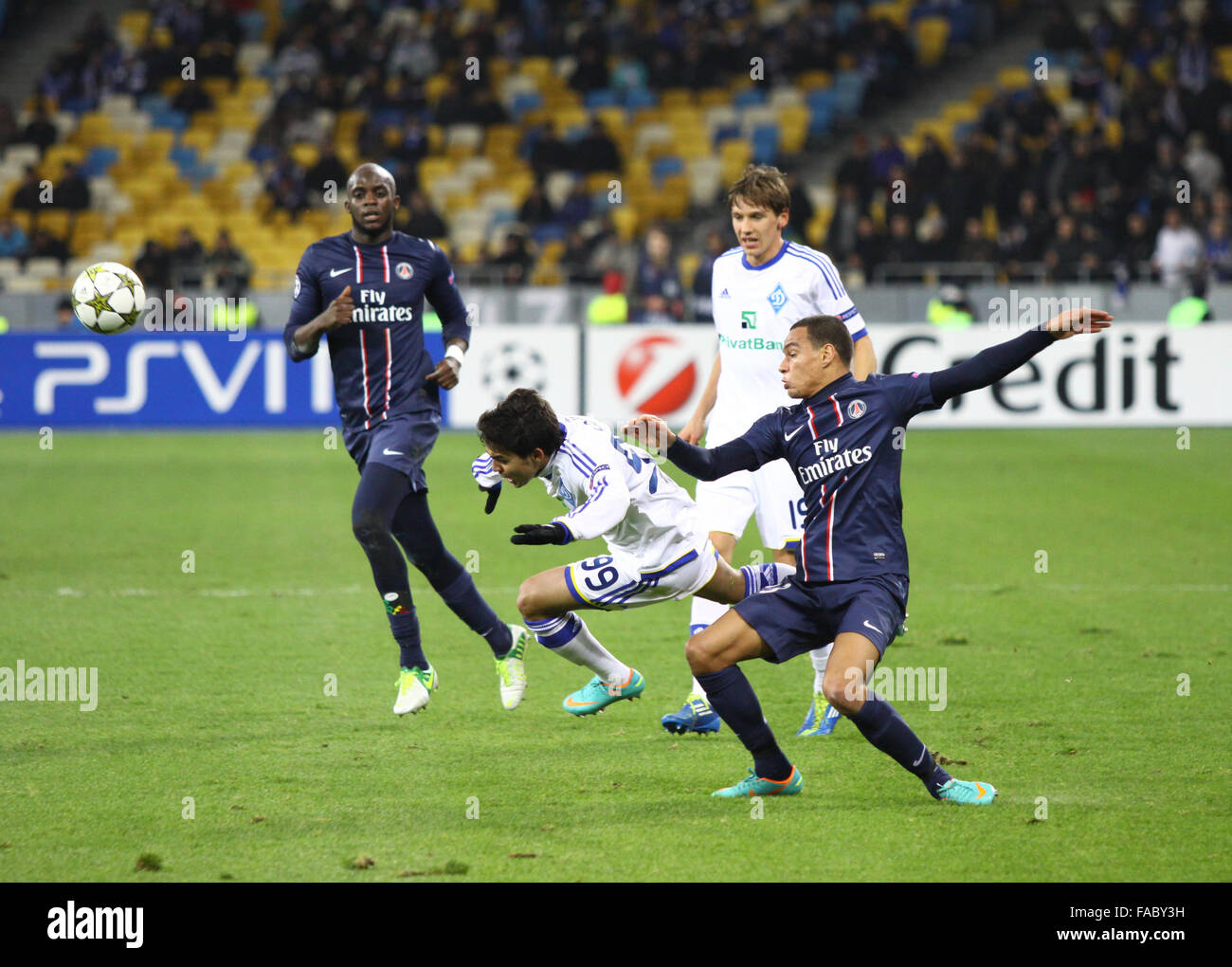 KYIV, UKRAINE - NOVEMBER 21, 2012: Gregory van der Wiel of FC Paris Saint-Germain (R, #23) fights for a ball with Dudu of FC Dynamo Kyiv (L, #99) during their UEFA Champions League game on November 21, 2012 in Kyiv, Ukraine Stock Photo