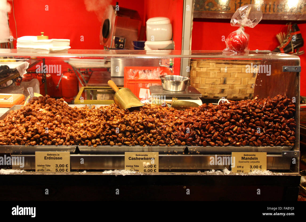 Market stall with candied toasted almonds in Berlin Christmas Market, Germany Stock Photo