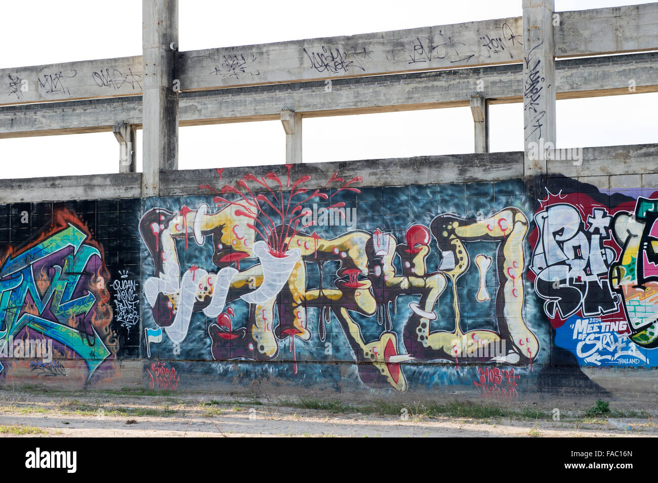HUA HIN ,THAILAND - May30,2015 :Graffiti abandoned old factory structure.Main Street entrance to the town Stock Photo