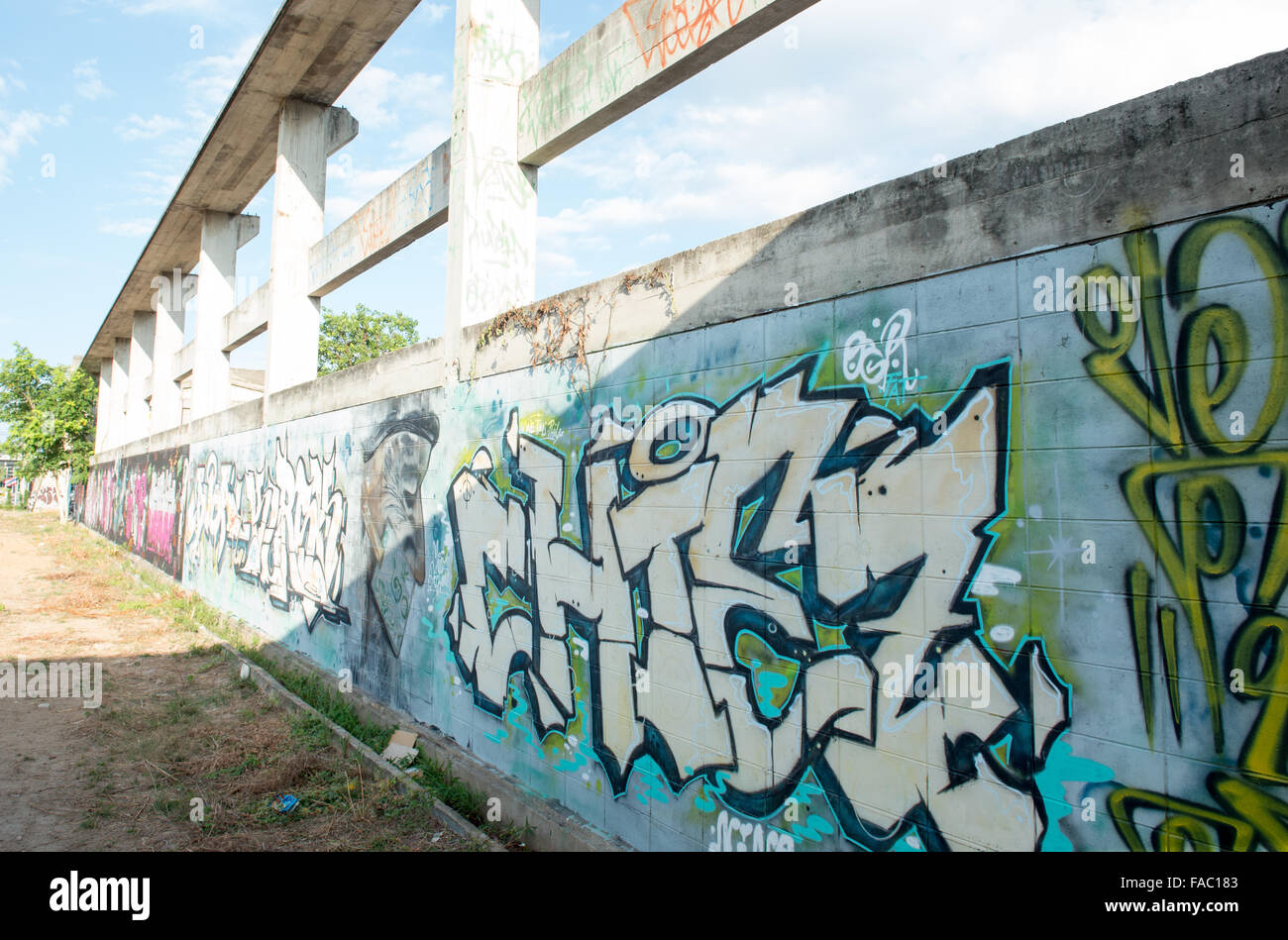 HUA HIN ,THAILAND - May30,2015 :Graffiti abandoned old factory structure.Main Street entrance to the town Stock Photo