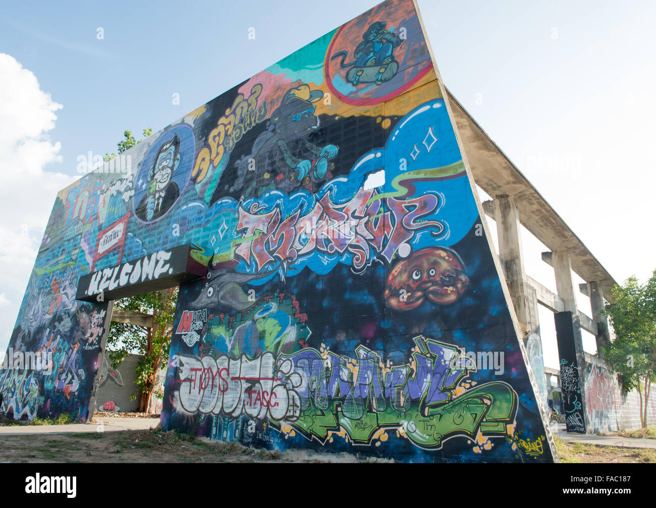 HUA HIN ,THAILAND - May30,2015 :Graffiti abandoned old factory structure.Main Street entrance to the town Stock Photo