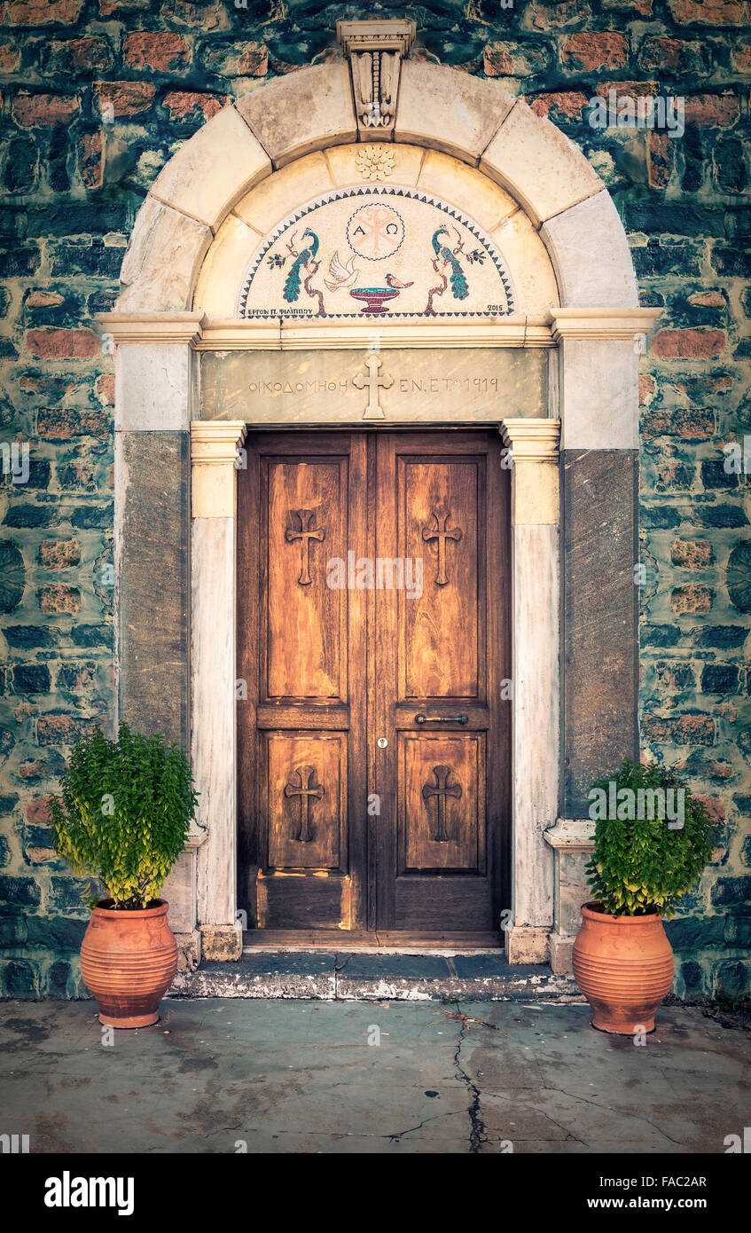 Vintage wooden door of orthodox church at greek Kos island Stock Photo