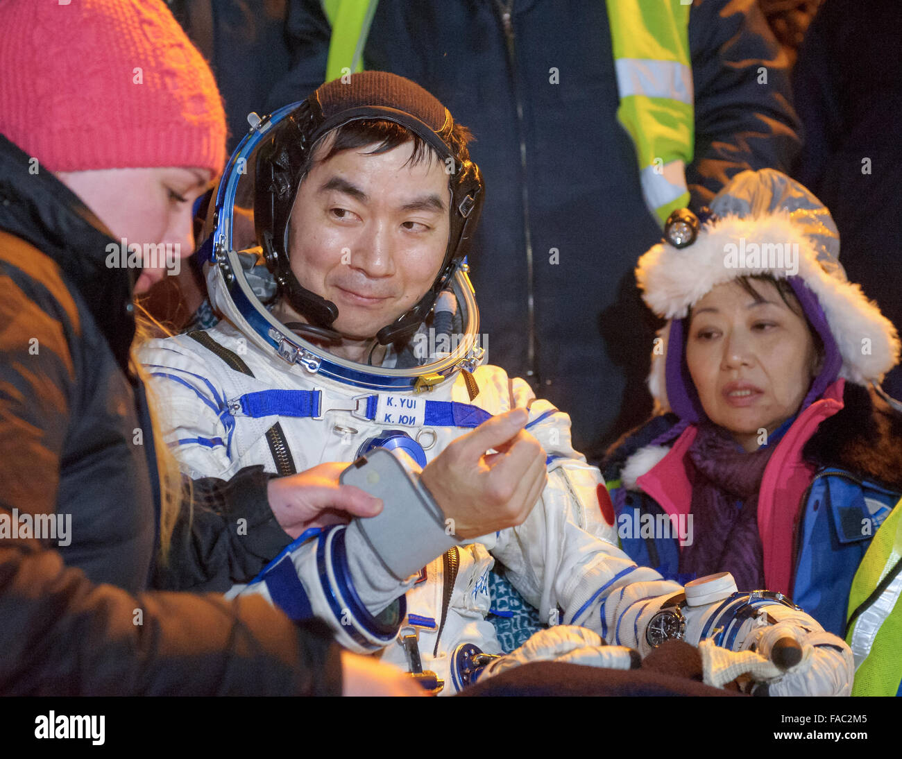 International Space Station Expedition 45 crew member Japanese astronaut Kimya Yui of the Japan Aerospace Exploration Agency has his medical check moments after landing in a remote area in the Soyuz TMA-17M spacecraft December 11, 2015 near Zhezkazgan, Kazakhstan. The crew is returning after 141 days onboard the International Space Station. Stock Photo