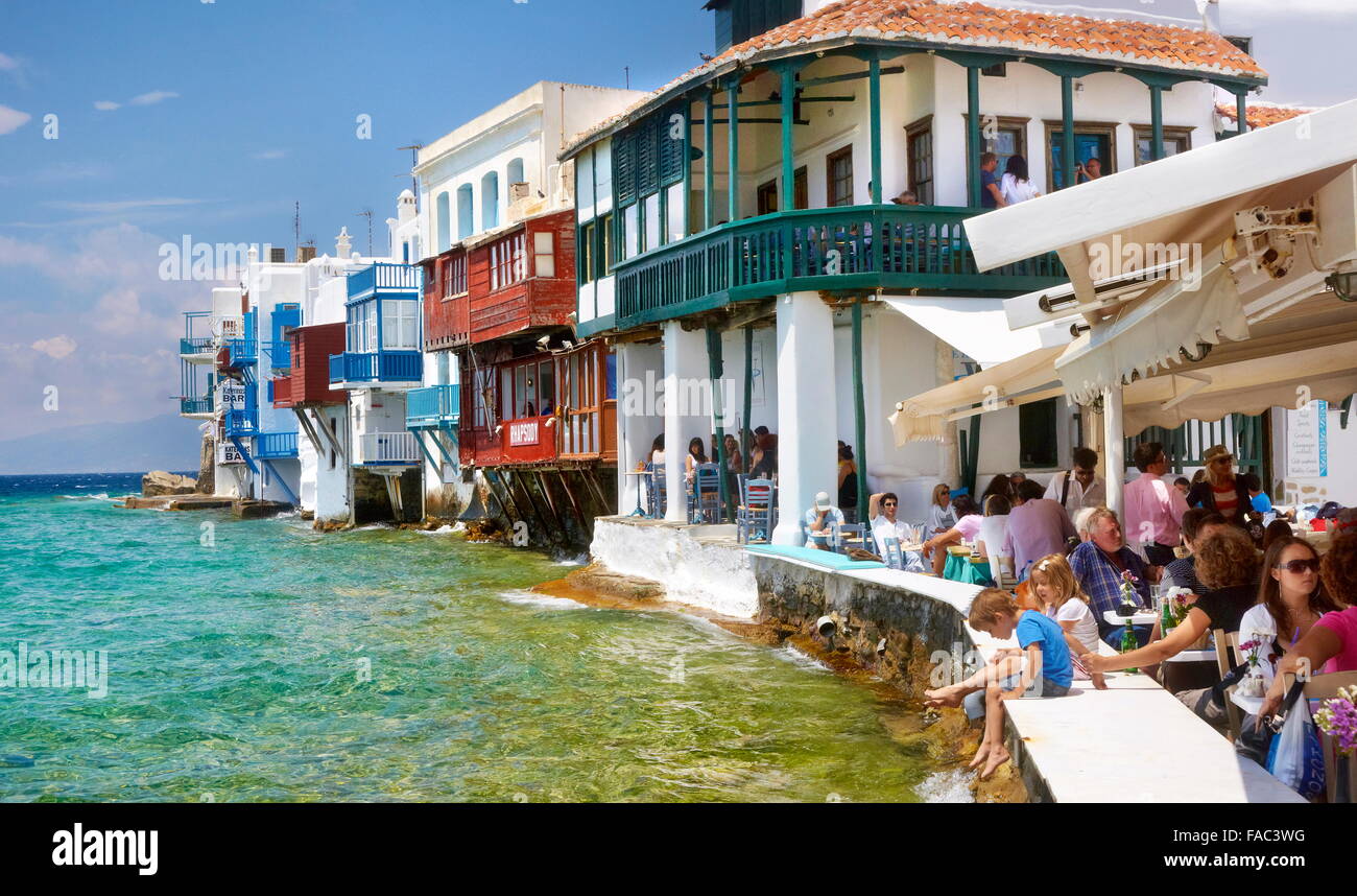 Tourists in cafe restaurant in Mykonos Town (Little Venice) - Mykonos Island, Greece Stock Photo