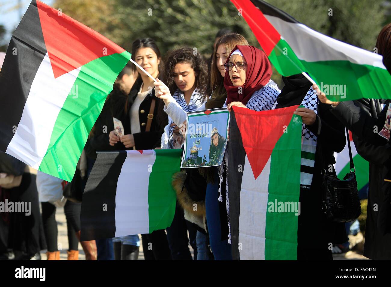 Jerusalem. 26th Dec, 2015. Palestinians take part in a protest outside Jerusalem's Old City on Dec. 26, 2015. Palestinians protested on Saturday, demanding the return of the bodies who have been killed during the latest wave of violence with Israel. © Muammar Awad/Xinhua/Alamy Live News Stock Photo