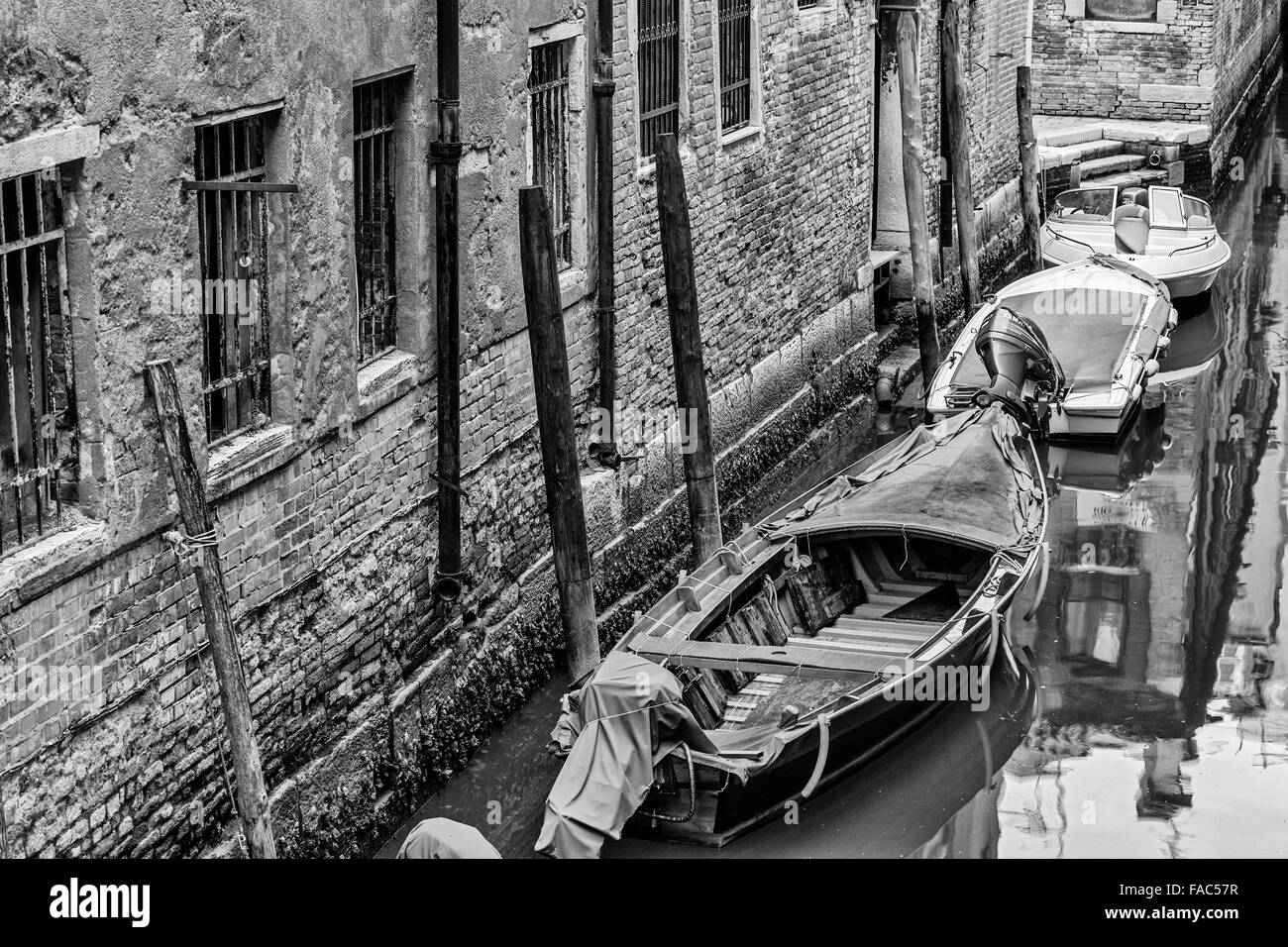 boats moored on canal, Venice Stock Photo