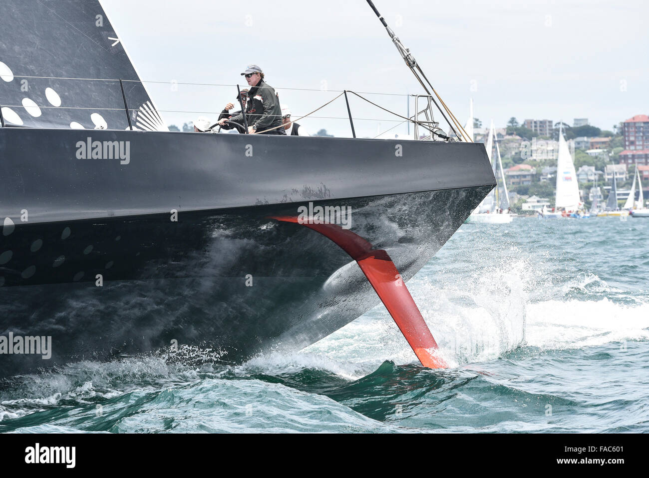 Sydney, Australia. 26th Dec, 2015. Rolex Sydney to Hobart Yacht race 2015. Comanche owned by Jim Clark &amp; Kristy Hinze Clark from SA skippered by skipper Ken Read type 100 Supermaxi during the start of the 629 nautical mile race from Sydney to Hobart on Sydney Harbour. © Action Plus Sports/Alamy Live News Stock Photo